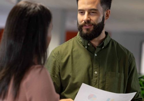 Leader listening empathetically during a workplace conversation, illustrating emotional intelligence and emotional labour in leadership