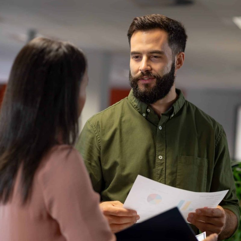 Leader listening empathetically during a workplace conversation, illustrating emotional intelligence and emotional labour in leadership